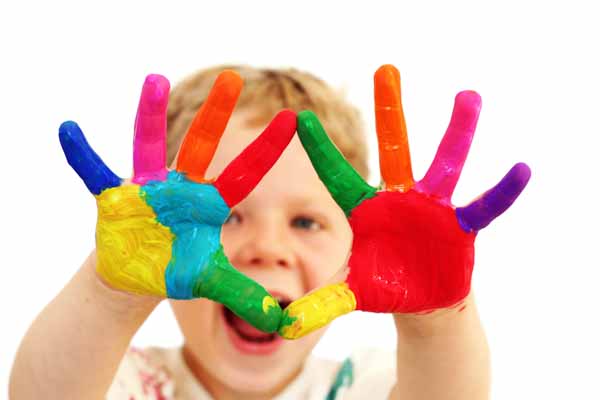 picture of happy child with painted hands