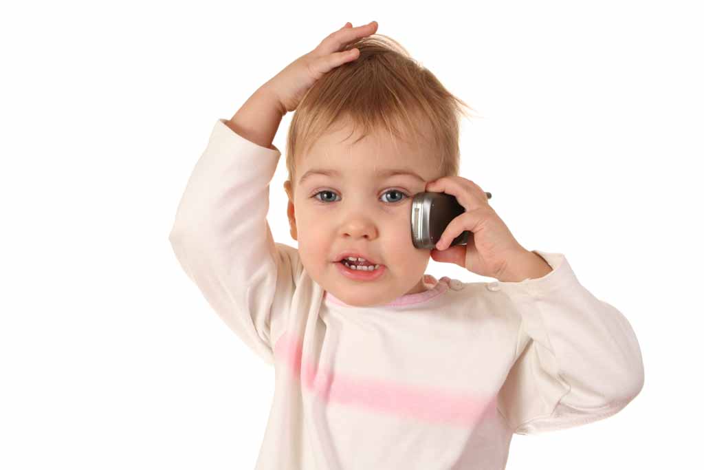 picture of young boy talking on cell phone